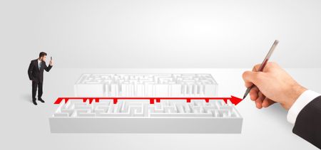 Business man looking at hand drawing solution,  maze solution concept