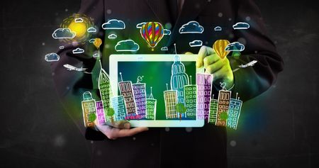 Young person showing tablet with hand drawn colorful cityscape