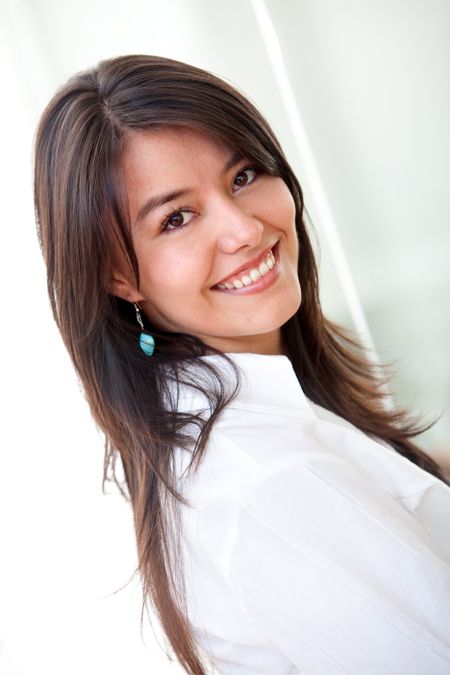 beautiful young brunette professional business woman smiling