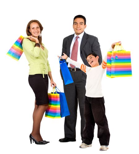 Family holding some shopping bags isolated over white