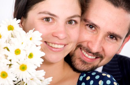 beautiful couple portrait - both smiling with white flowers