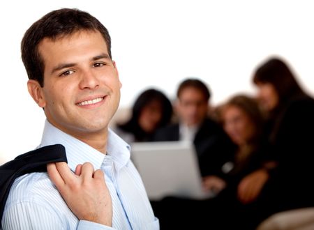 Confident businessman with a group behind, isolated