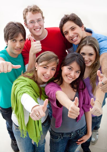 Happy group of friends with thumbs up