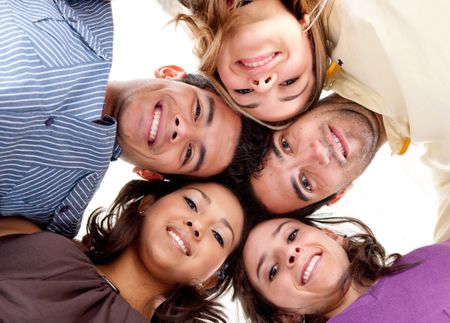 Group of friends with their head together in the middle isolated