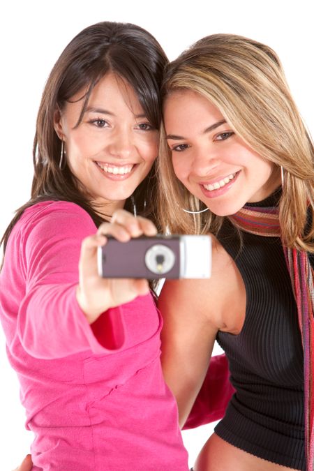Women taking a picture of themselves isolated over white