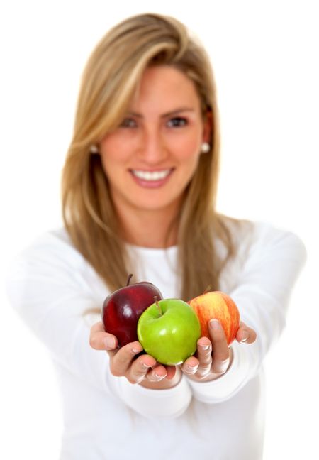 Healthy woman holding some apples isolated over white