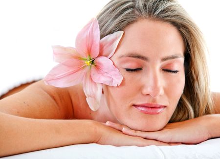 beautiful female resting eyes shut with flower isolated