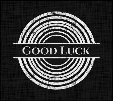 Good Luck chalkboard emblem written on a blackboard