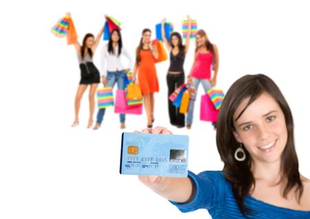 Girl holding a credit card and shopping women behind her isolated