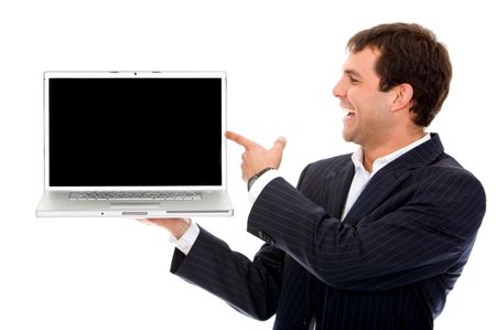Business man pointing at a laptop computer isolated