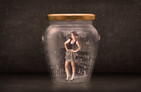 Businesswoman traped in jar with graph chart symbols concept on background
