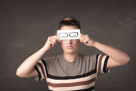 Happy girl looking with hand drawn eye glasses paper concept