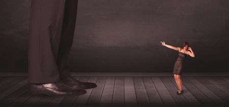 Big person with small businesswoman concept on background