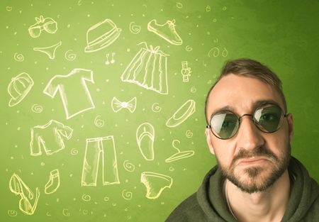 Happy young man with glasses and casual clothes icons concept on green background