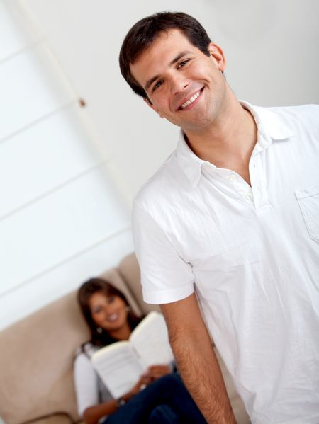 Beautiful loving happy couple at home smiling