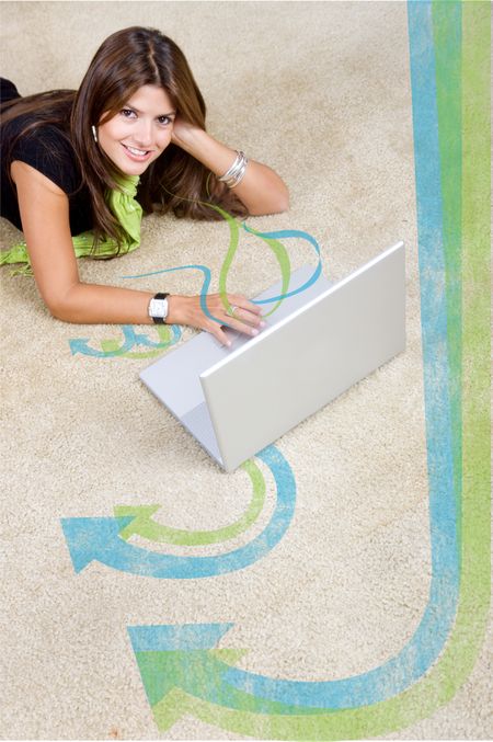 woman with a laptop working from home smiling