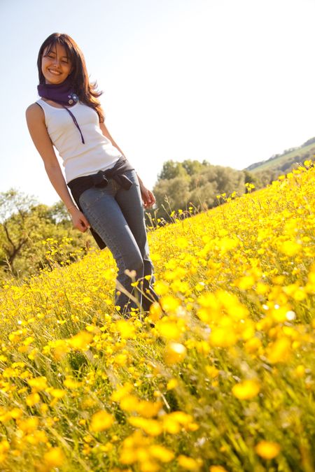 Beautiful woman smiling outdoors in a flower field
