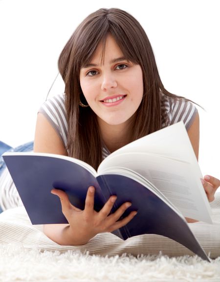beautiful student smiling and reading a book - isolated over white