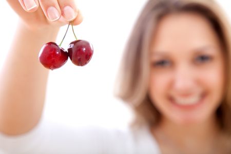 woman displaying a bunch of cherries isolated over a white background