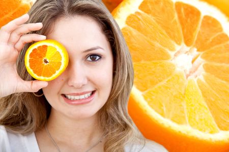 Woman with a slice of orange in her eye