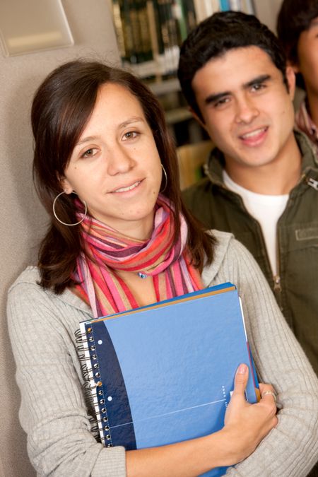 couple of students studying in a library