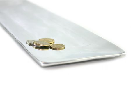 coins on an aluminium tray
