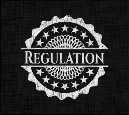 Regulation chalk emblem written on a blackboard