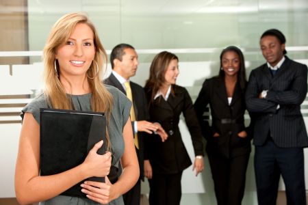 Business woman with a portfolio and her team