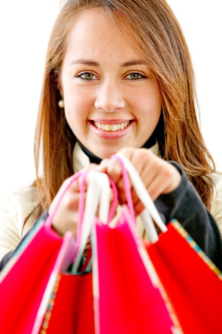 beautiful girl with shopping bags - isolated over a white background