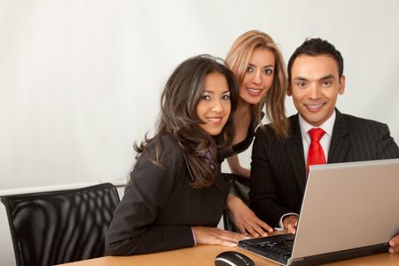 Business team in an office with a laptop computer