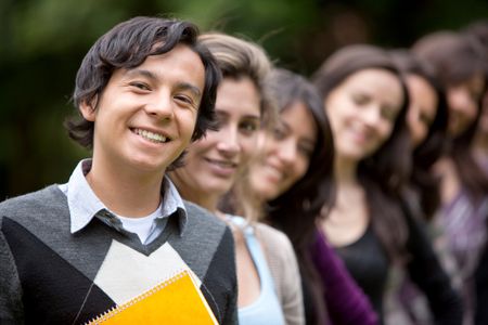 Group of students lined up outdoors smiling