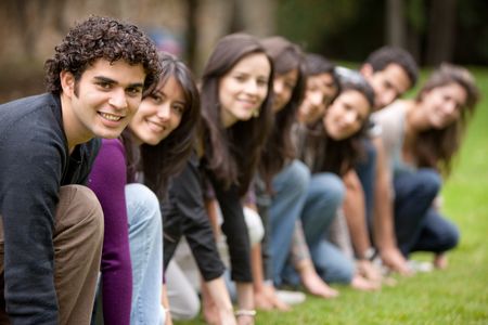 Group of friends ready to race outdoors