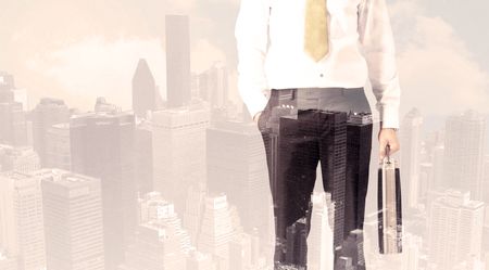 Handsome business man with overlay cityscape background