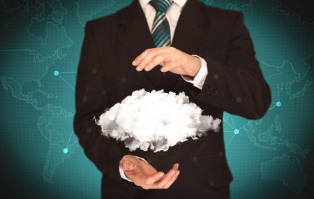 Elegant business person holding an empty white cloud in its hands in front of green wall background with world map illustration concept