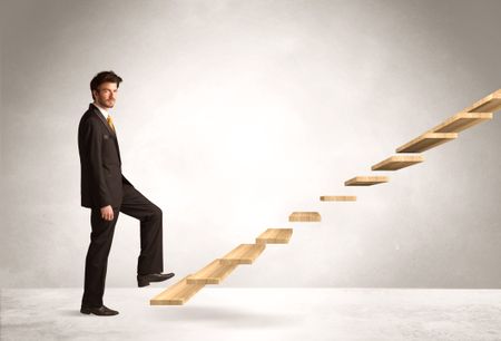 Business person stepping up a staircase