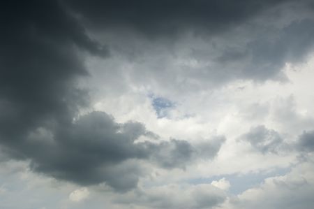 Patch of blue sky at heart of rain clouds