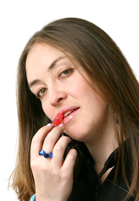 girl applying lipstick