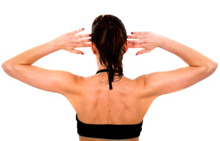 beautiful fit female back during exercise over a white background