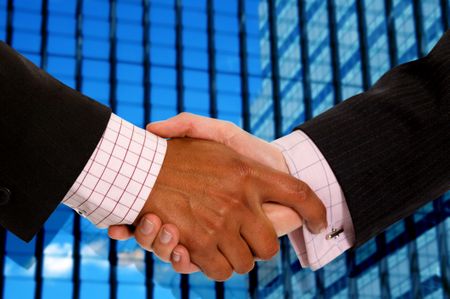 diverse business men shaking hands in a corporate environment