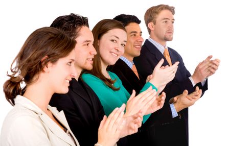 group of business people in an office applauding and smiling at success - focus is on the girl looking at the camera - isolated over white