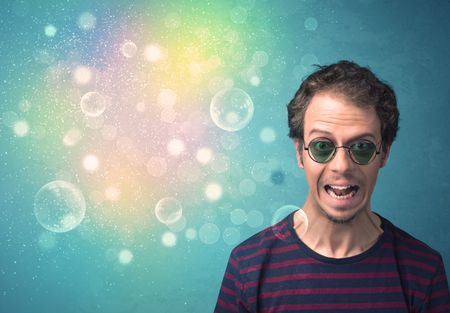 young-man-sunglasses-bokeh-colourful-lights-344843240 Young man with sunglasses and bokeh colourful lights concept