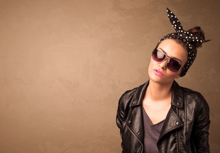 portrait-young-pretty-woman-sunglasses-copyspace-344843369 Portrait of a young pretty woman with sunglasses and copyspace on brown background