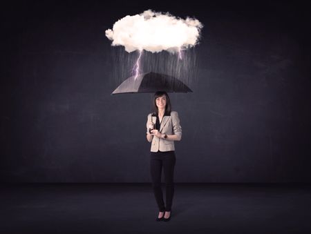 Businesswoman standing with umbrella and little storm cloud concept on background