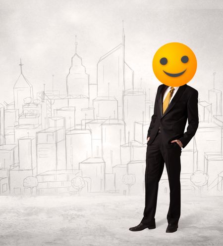 Funny businessman wears yellow smiley face