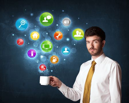 Businessman standing and holding a white cup with colorful setting icons coming out of the cup