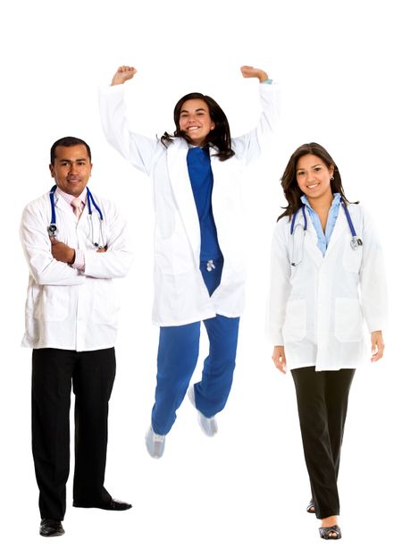 Group of happy doctors standing isolated over white