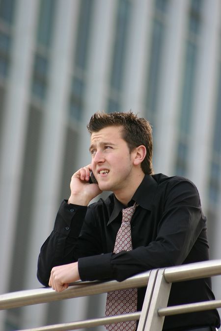 business man receiving bad news on the phone