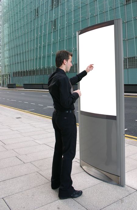 business man pointing at something on a white box