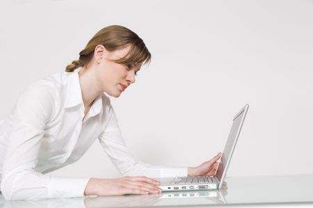 Businesswoman working on a laptop.