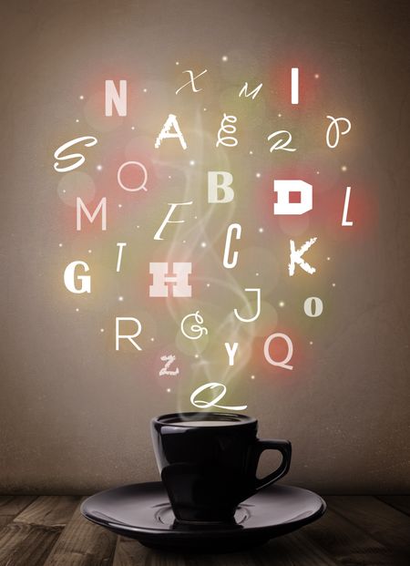 Coffee cup with colorful letters, close up